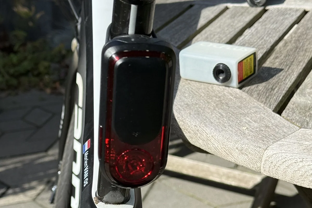 Rear view of the Garmin Varia RearVue 820 on a Cannondale Synapse seatpost, red lens facing the road