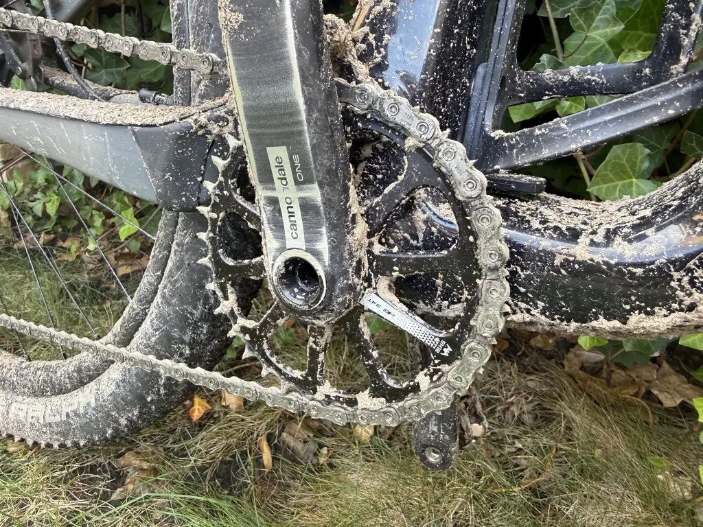 Cannondale One crank with a 34-tooth narrow-wide chainring, sand stuck between the teeth and caked on the crank arm and chainstay